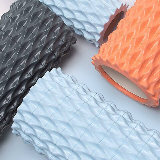 Fishbone Yoga Pillar foam massage roller in ocean blue, deep sea gray, and coral orange for muscle recovery and stretching.
